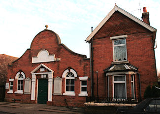 Photograph of Lydd Memorial Hall and adjacent residence